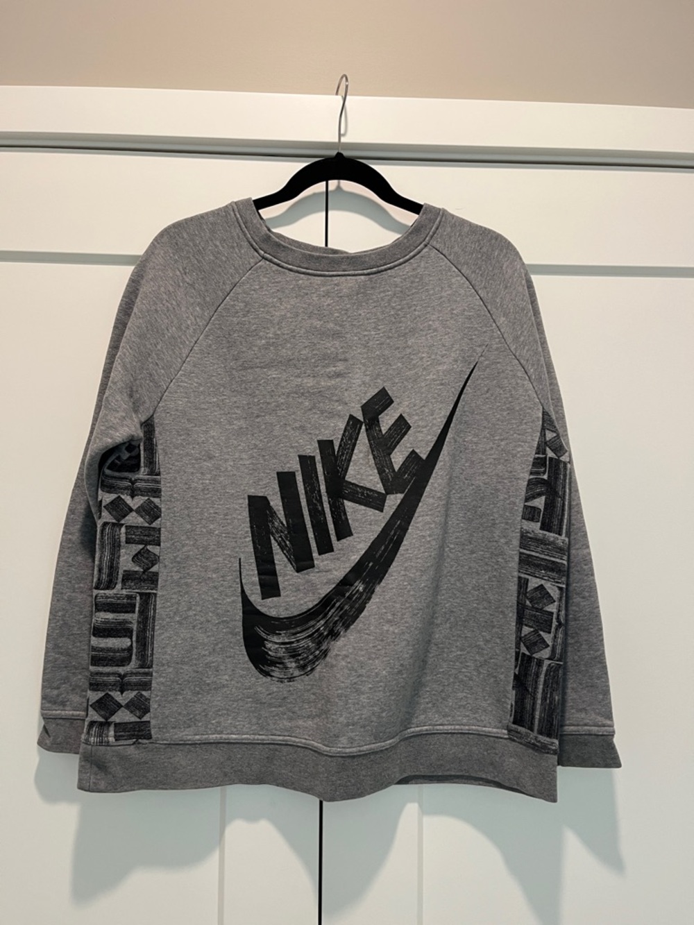 Women’s Nike Gray Geometric Crewneck Sweatshirt with Black Swoosh Graphic